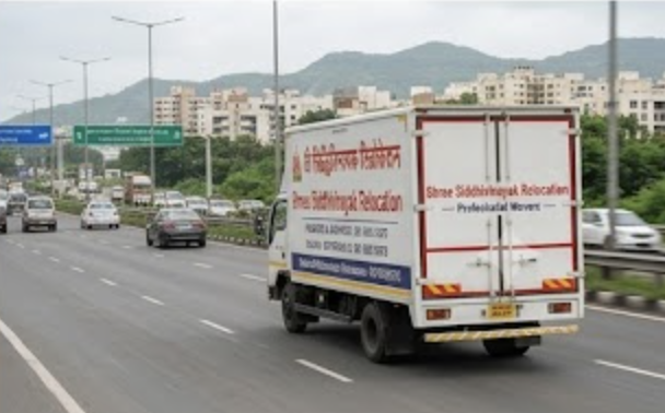 Shree Siddhivinayak relocation truck on highway