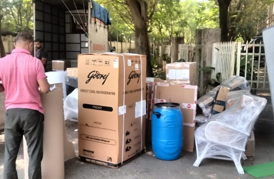 Household appliances and cartons prepared for moving